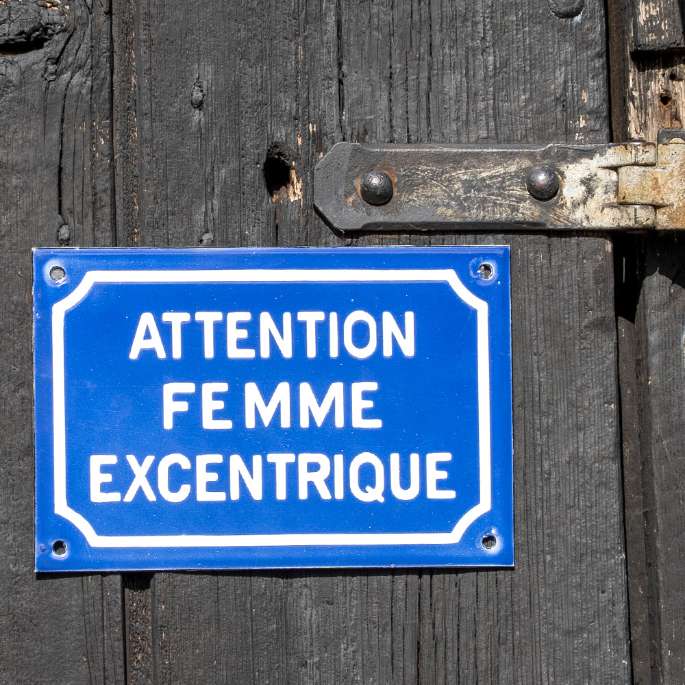 "Attention Femme Excentrique" Comical French Enamel Sign.