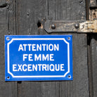 "Attention Femme Excentrique" Comical French Enamel Sign.