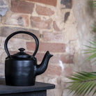 Small Black Cast Iron Kettle.