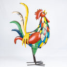 Colorful metal rooster sculpture on a white background