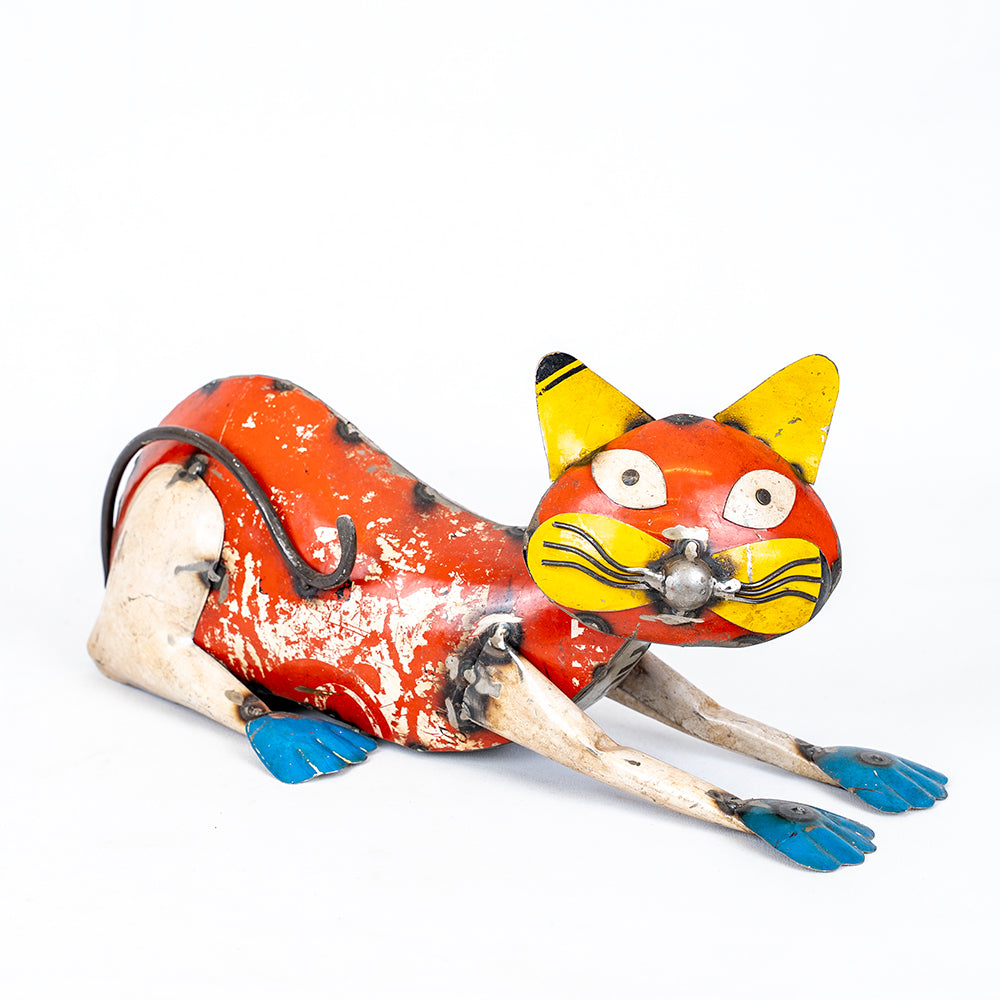 Vintage tin toy cat on a white background