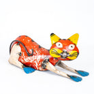 Vintage tin toy cat on a white background