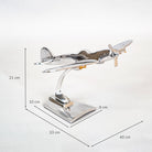 Metal airplane model with dimensions on a white background